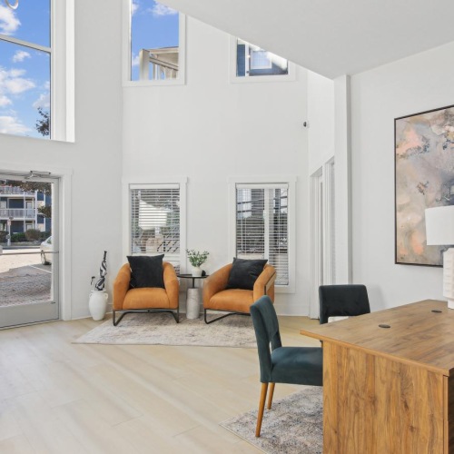 Find your perfect fit at Muse ATL a leasing office room with a desk and chairs