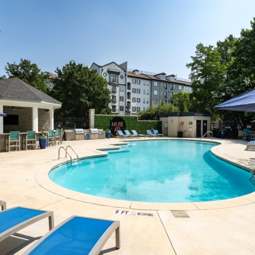 Swimming pool with lounge chairs at Muse ATL boutique apartments in Atlanta Swimming pool with lounge chairs at Muse ATL boutique apartments in Atlanta