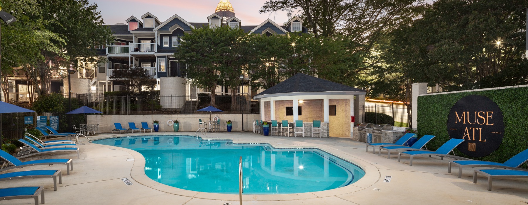 Swimming pool with lounge chairs at Muse ATL boutique apartments in Atlanta	