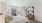 a bedroom with a bed and a mirror